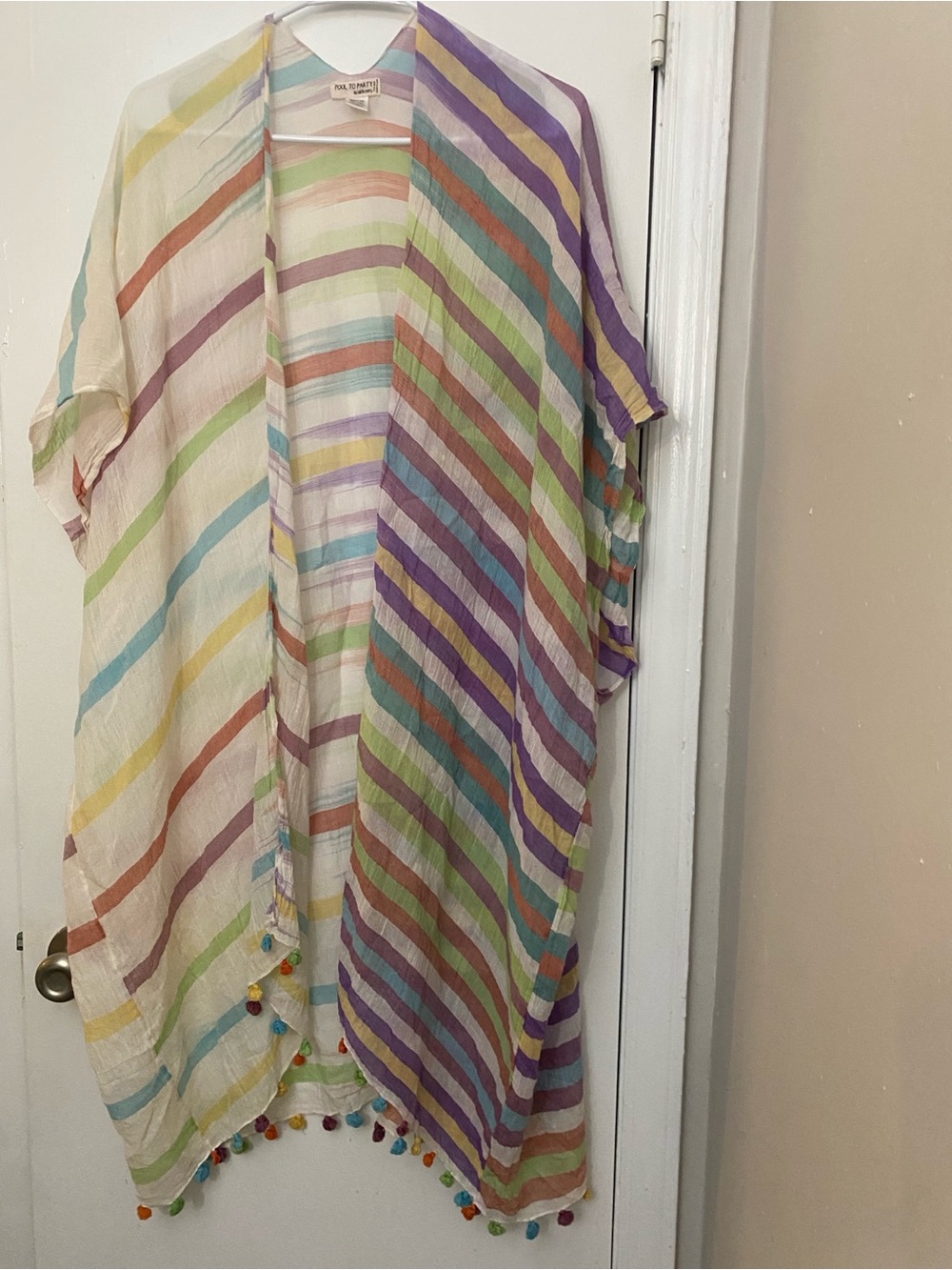 Pool to party by subtle luxury one Pom
Pom coverup